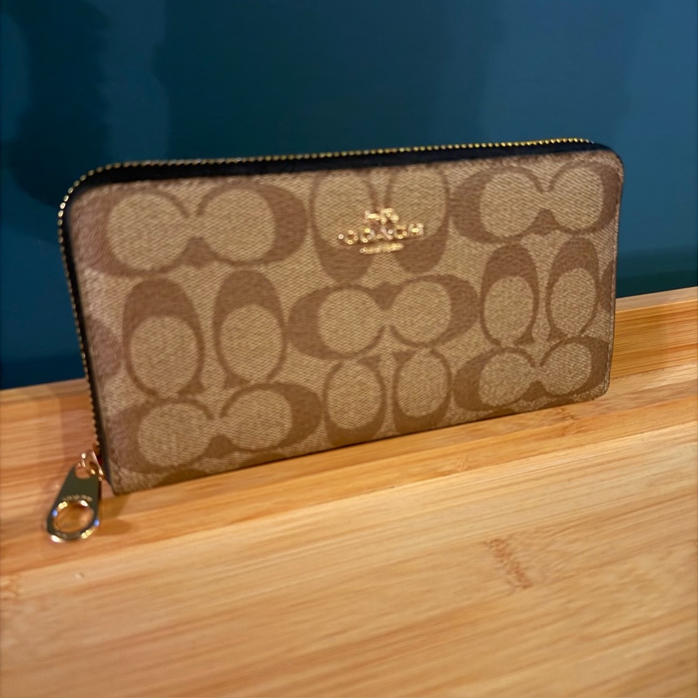 Coach monogrammed zip-around wallet